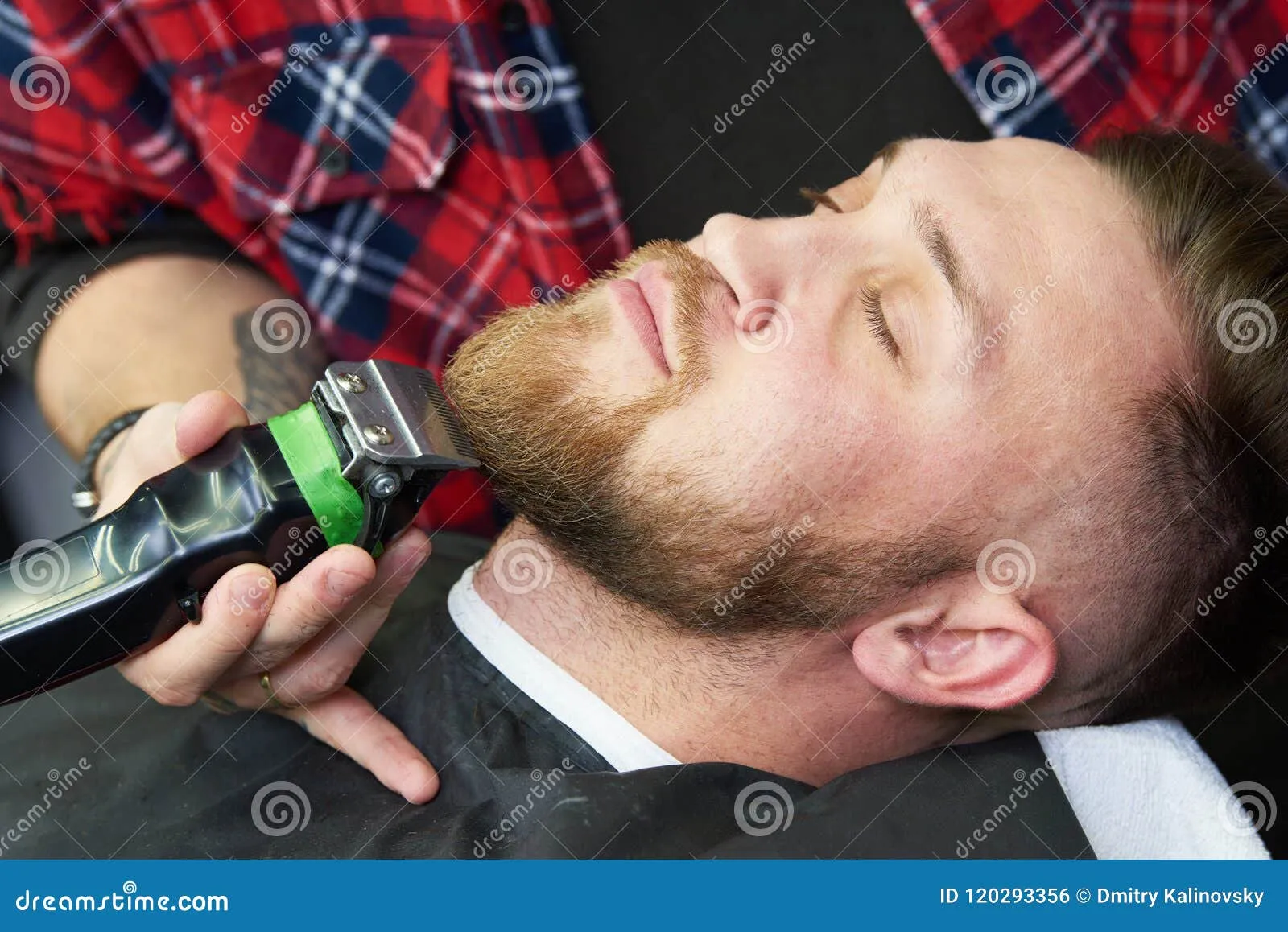 Man trimming his beard