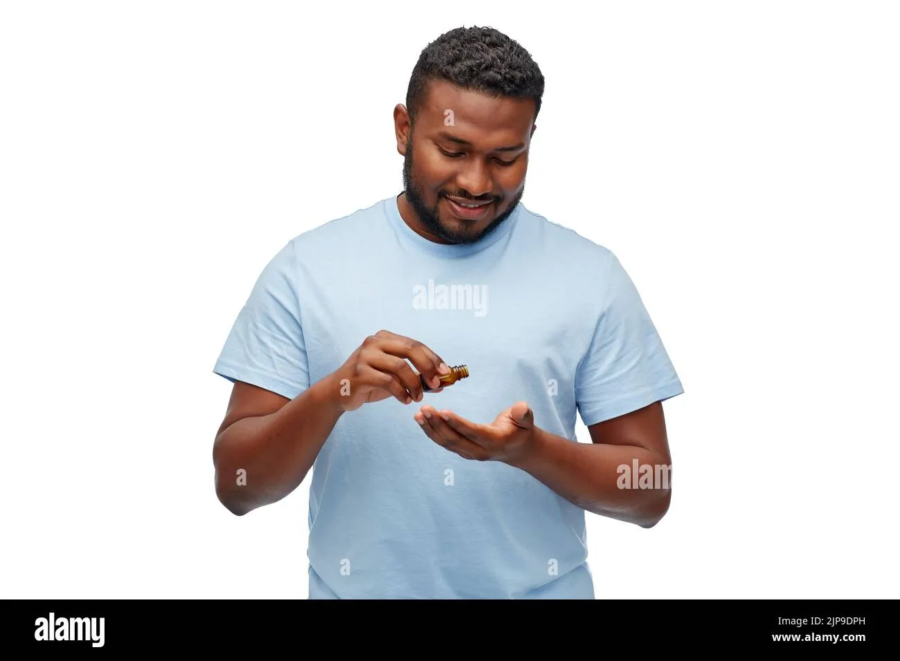 man applying beard oil