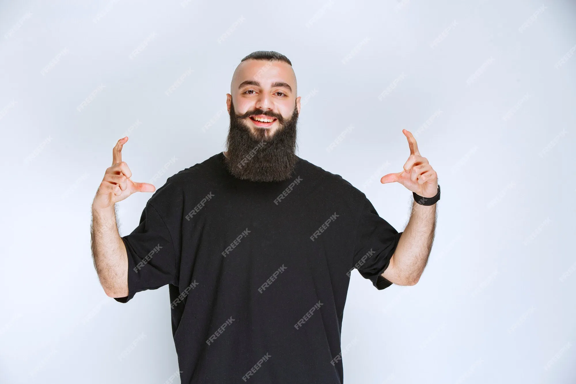 Person with beard showing off stickers